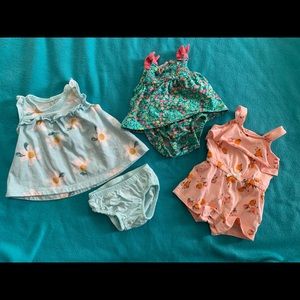 Three newborn girl dress and rompers. CARTERS
